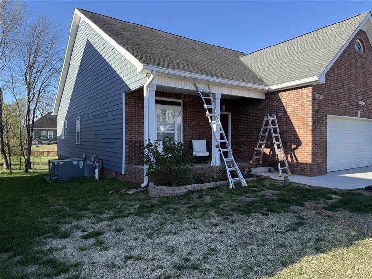 Residential gutter work showing roofline and installed gutter system